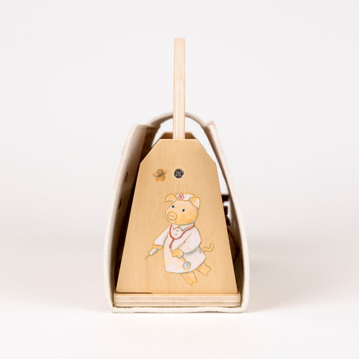 Side of wooden box with cartoon pig design on a white background