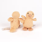 Two plush duck toys on a white background with a visible brand tag.