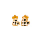 Heart-shaped earrings with gold, black, and white checkered pattern on a white background