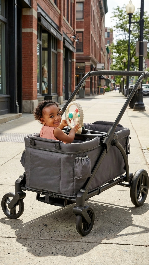 Child in a gray stroller on a city street
