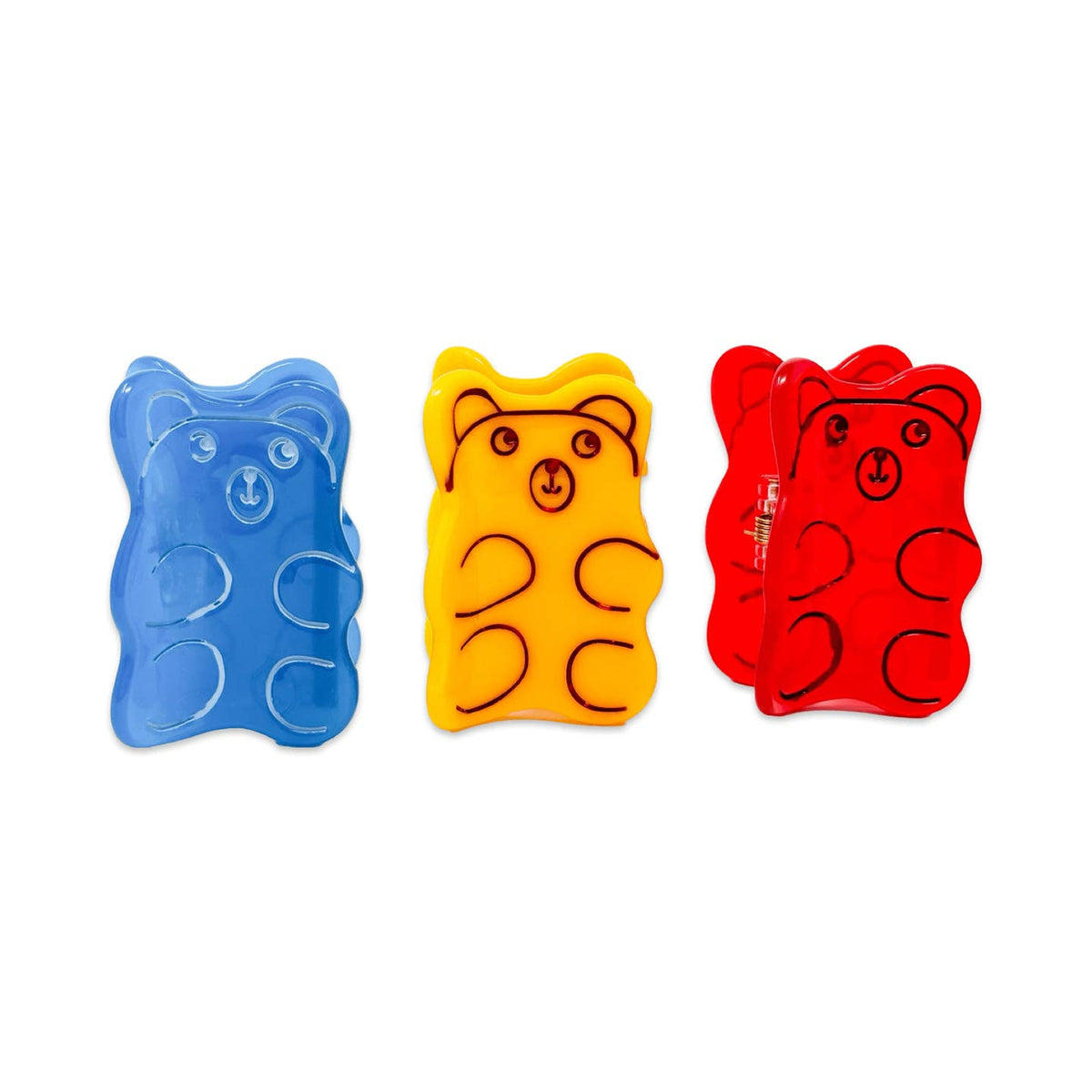 Three gummy bear-shaped items in blue, yellow, and red on a white background