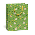 Green gift bag with dog and flower pattern on a white background