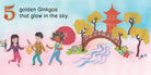 A colorful illustration from the book A Walk In The Forest showing a landscape with a stream, an arched bridge, a pagoda, ginkgo trees with golden leaves, and three children walking, accompanied by the text: "5 golden Ginkgos that glow in the sky."