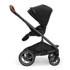 A profile view of a black MIXX Next + Pipa Aire RX Travel System by Nuna stroller featuring brown leatherette handlebar and armbar accents, shown against a checkered transparent background.