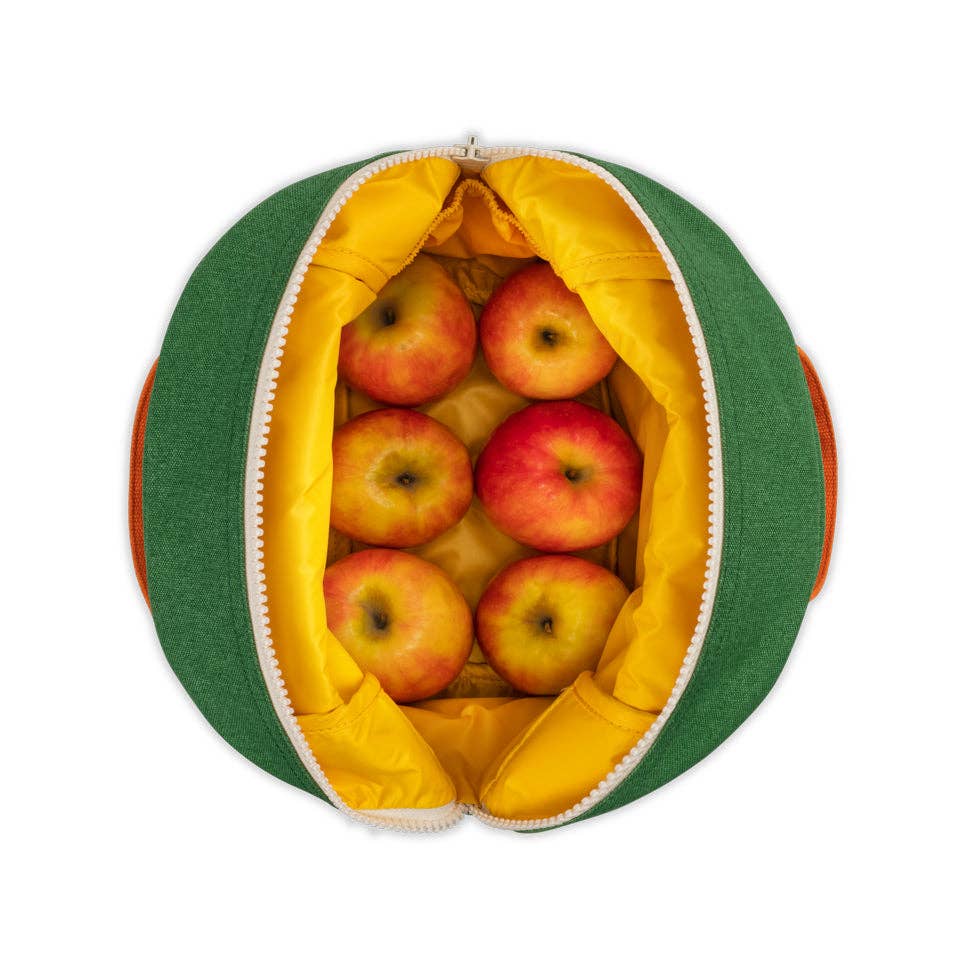 Green and yellow reusable produce bag filled with apples on a white background