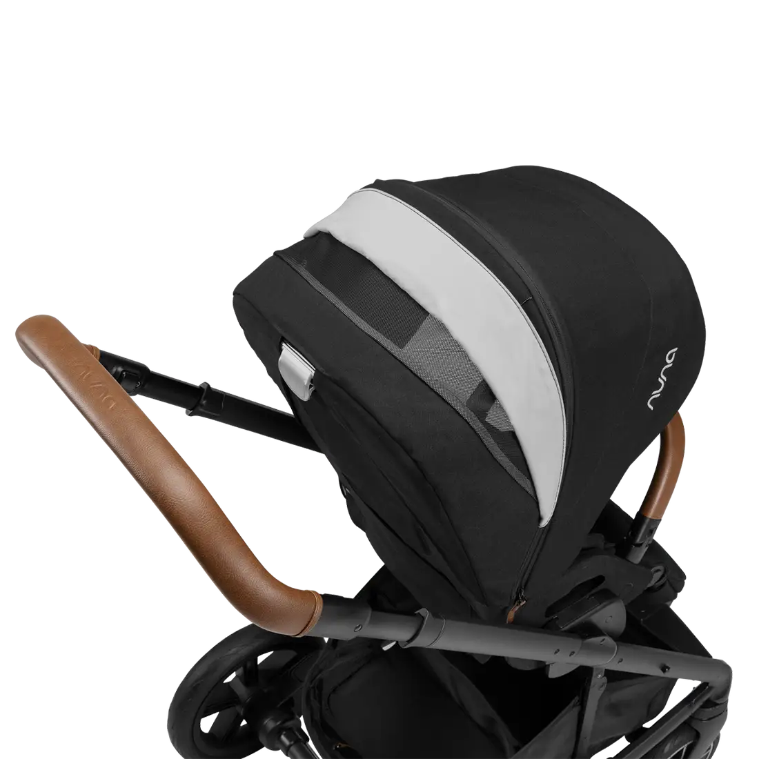 A close-up profile view of the black MIXX Next + Pipa Aire RX Travel System by Nuna stroller showing the brown leatherette handlebar and an extended canopy with an open white ventilation panel, set against a checkered transparent background.