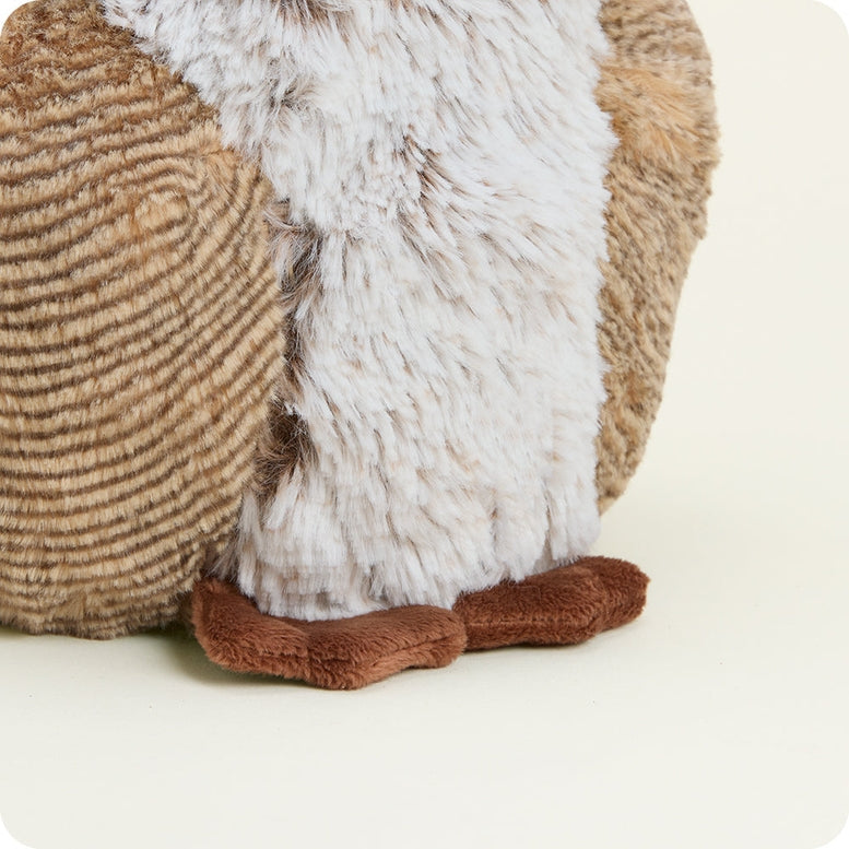 Woodland Owl by Warmies plush toy featuring brown and white textured fur, round yellow eyes, and an orange beak against a plain white background.