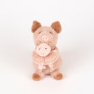 A plush toy set featuring a larger light pink pig holding a smaller matching pig, photographed against a seamless white studio background.