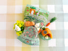 Miniature playset with bunny and carrot design on a checkered background