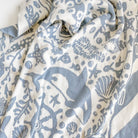 Close-up of a fabric with blue and white sea-themed pattern