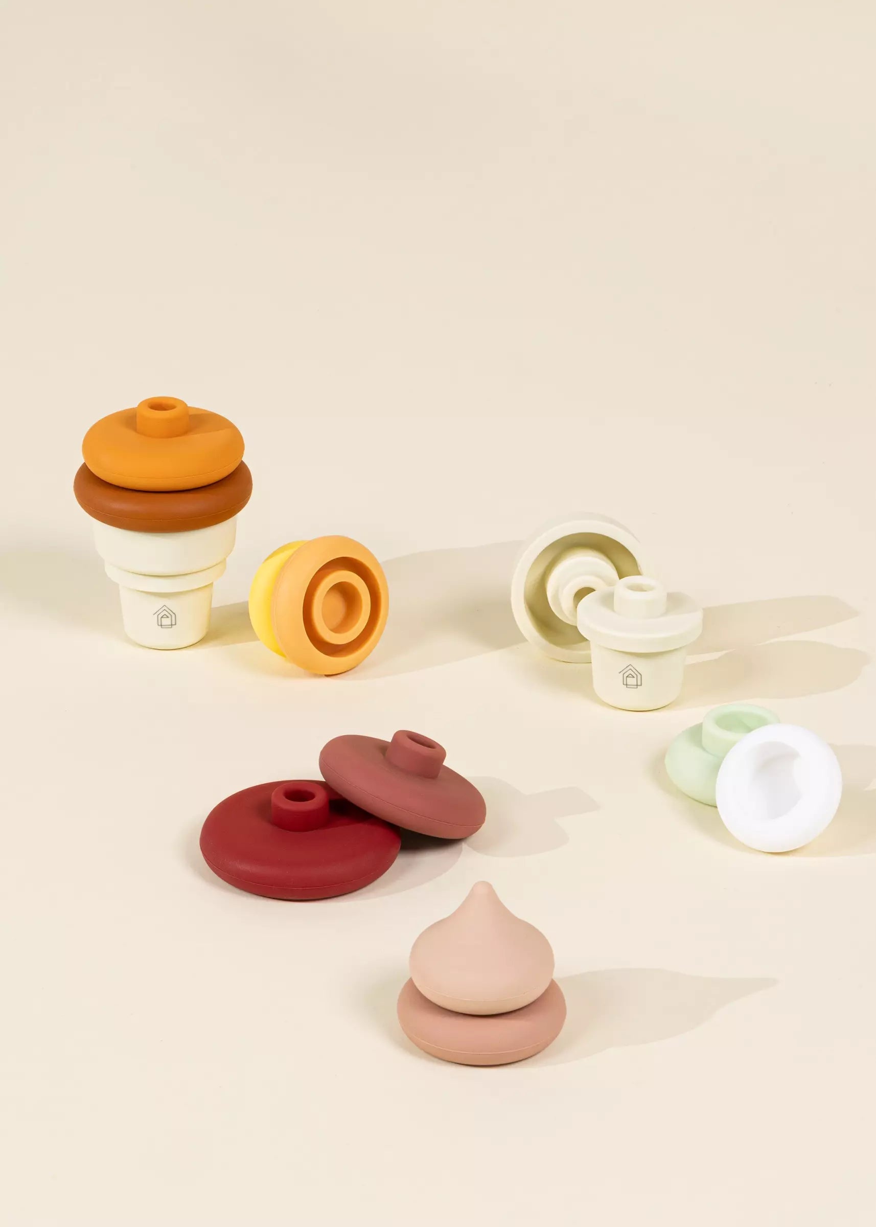 Set of colorful wooden toys on a beige background