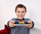 Child holding a smartphone with a pyramid of colorful candies on a white background