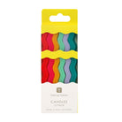 Pack of colorful candles in a wavy pattern with a yellow top on a white background