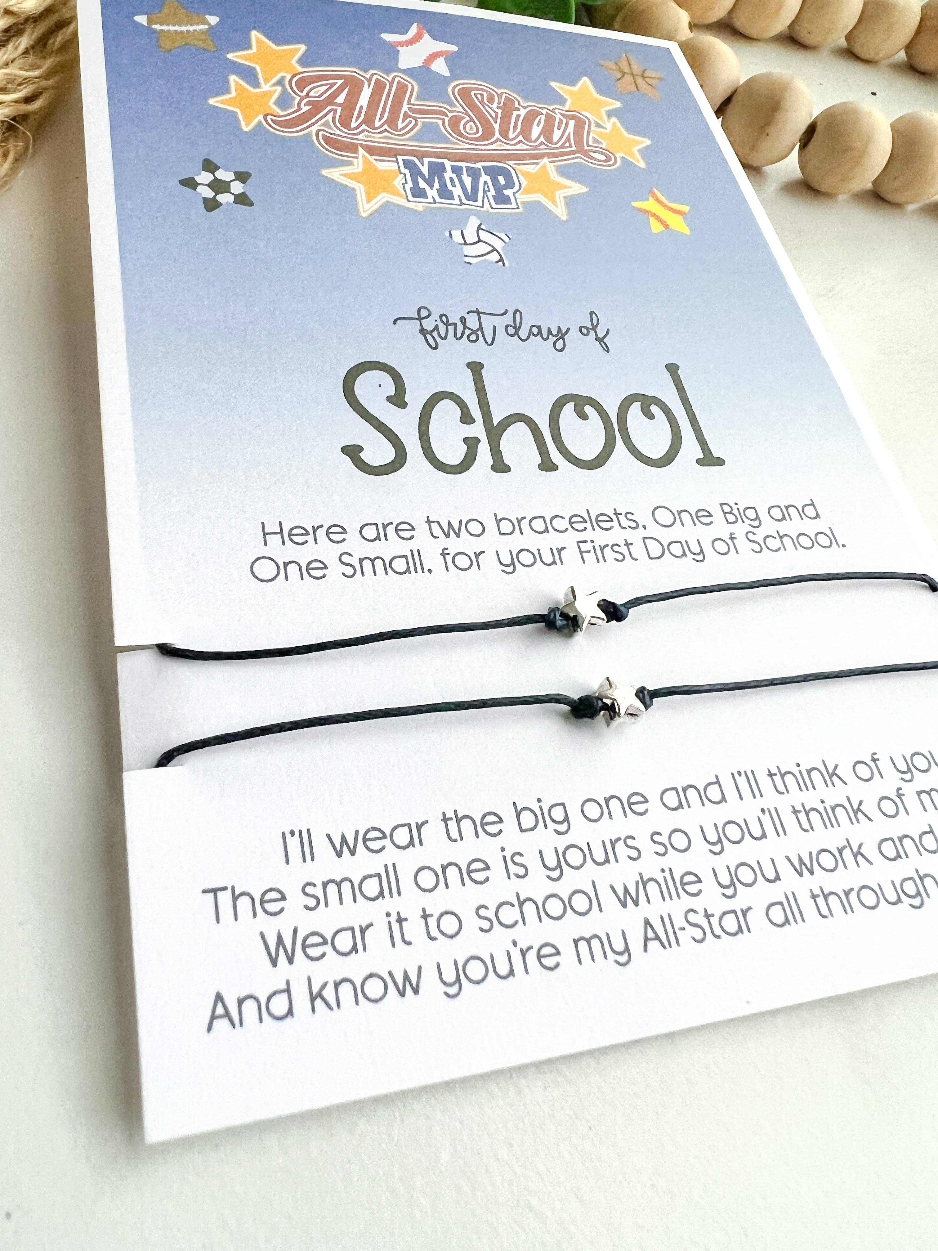 Two bracelets in a packaging with a message for the first day of school on a light background.
