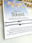 Two bracelets in a packaging with a message for the first day of school on a light background.