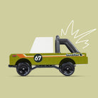 Toy truck with '67' and 'SandKat' branding on a beige background
