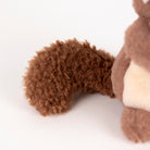 Close-up of a brown plush toy on a white background