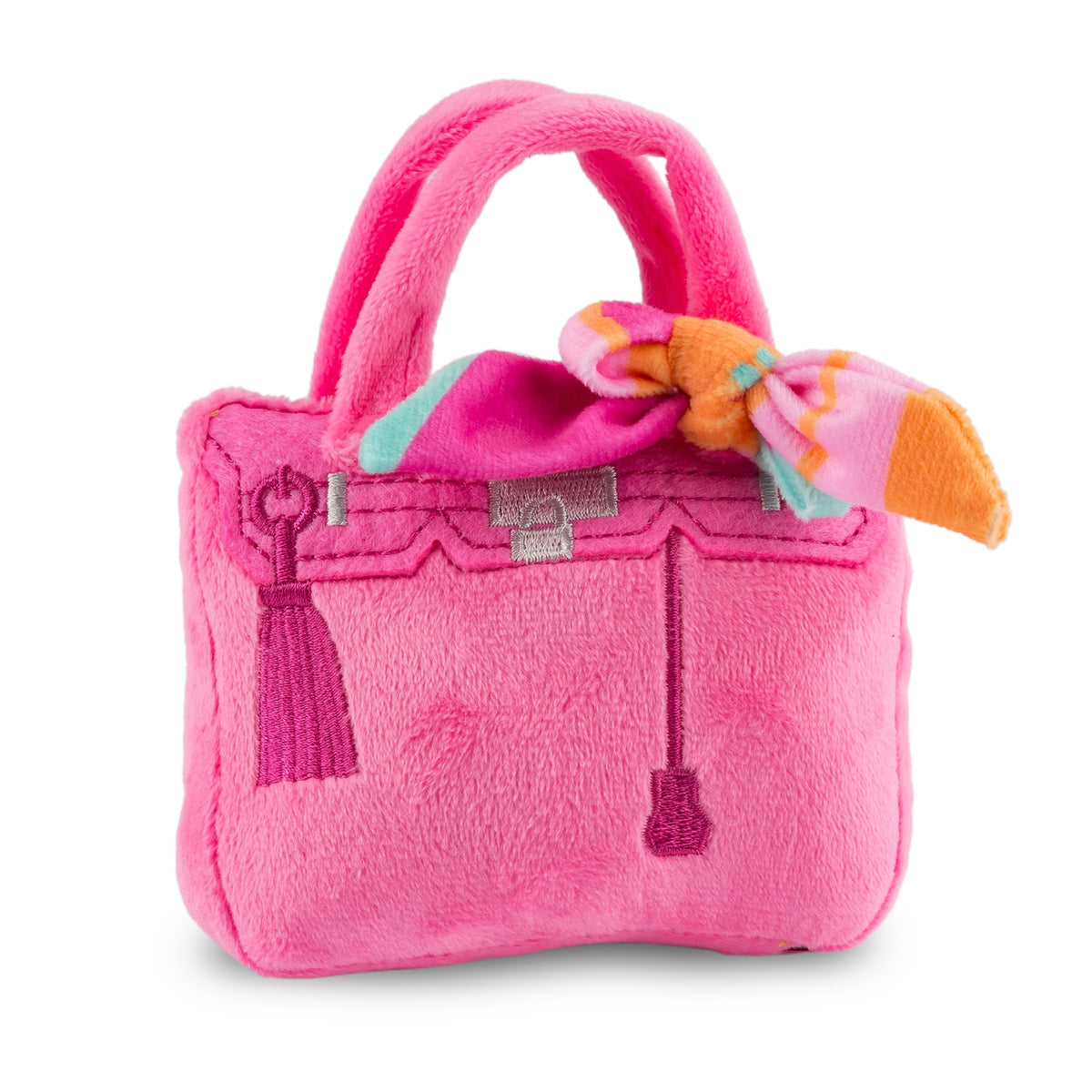 Pink plush handbag with a bow on a white background