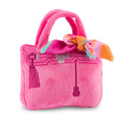 Pink plush handbag with a bow on a white background