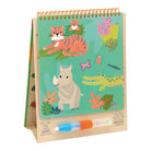 A children's coloring book with a stand-up cardboard cover, featuring illustrated animals including a tiger, rhinoceros, crocodile, frog, and butterfly on a teal background. A blue and orange ROCK! brand marker is placed in front of the book.