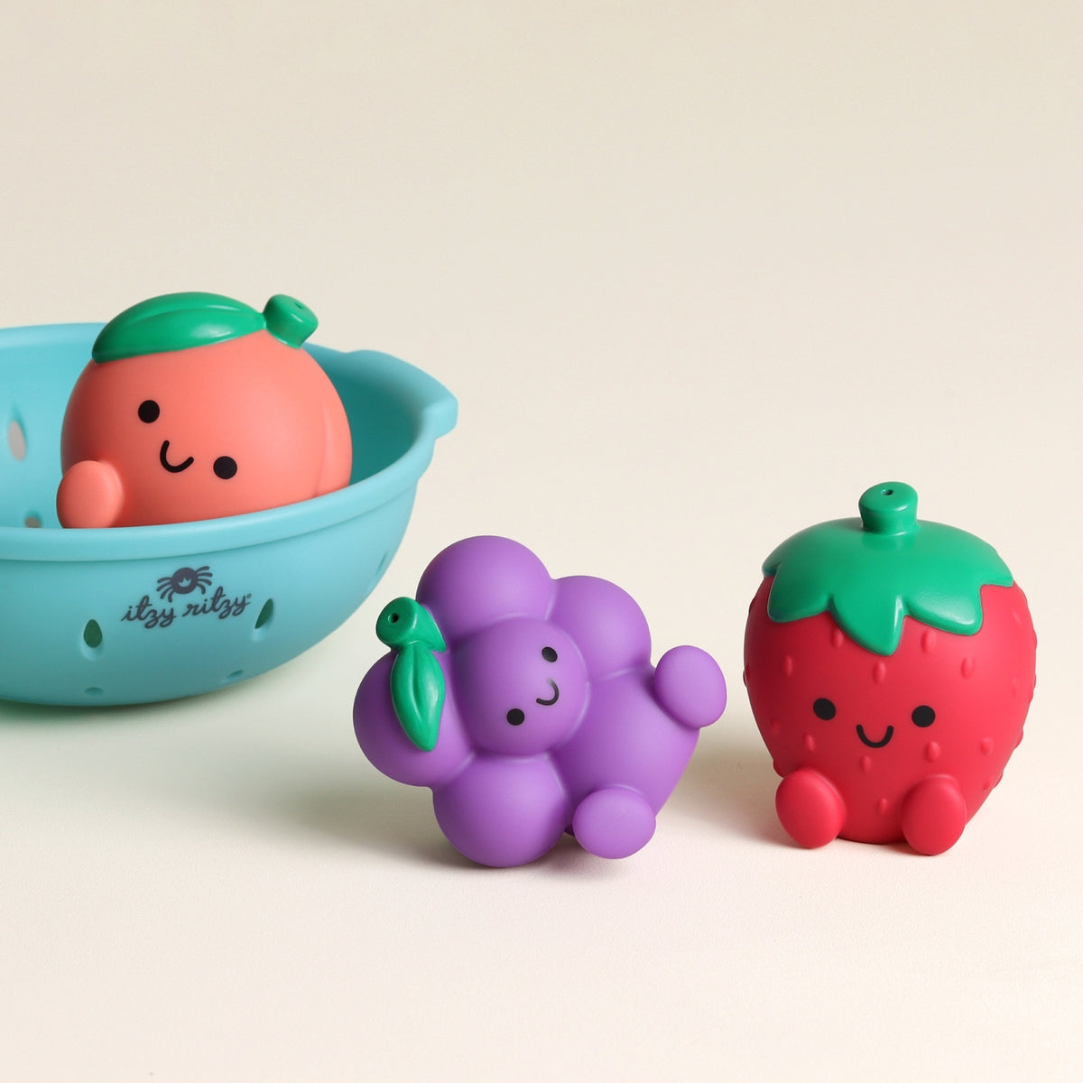Set of colorful fruit-shaped toys on a light background