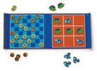 Children's checkers game with dinosaur pieces on a blue and orange board