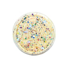 Bowl of vanilla ice cream with colorful sprinkles on a white background