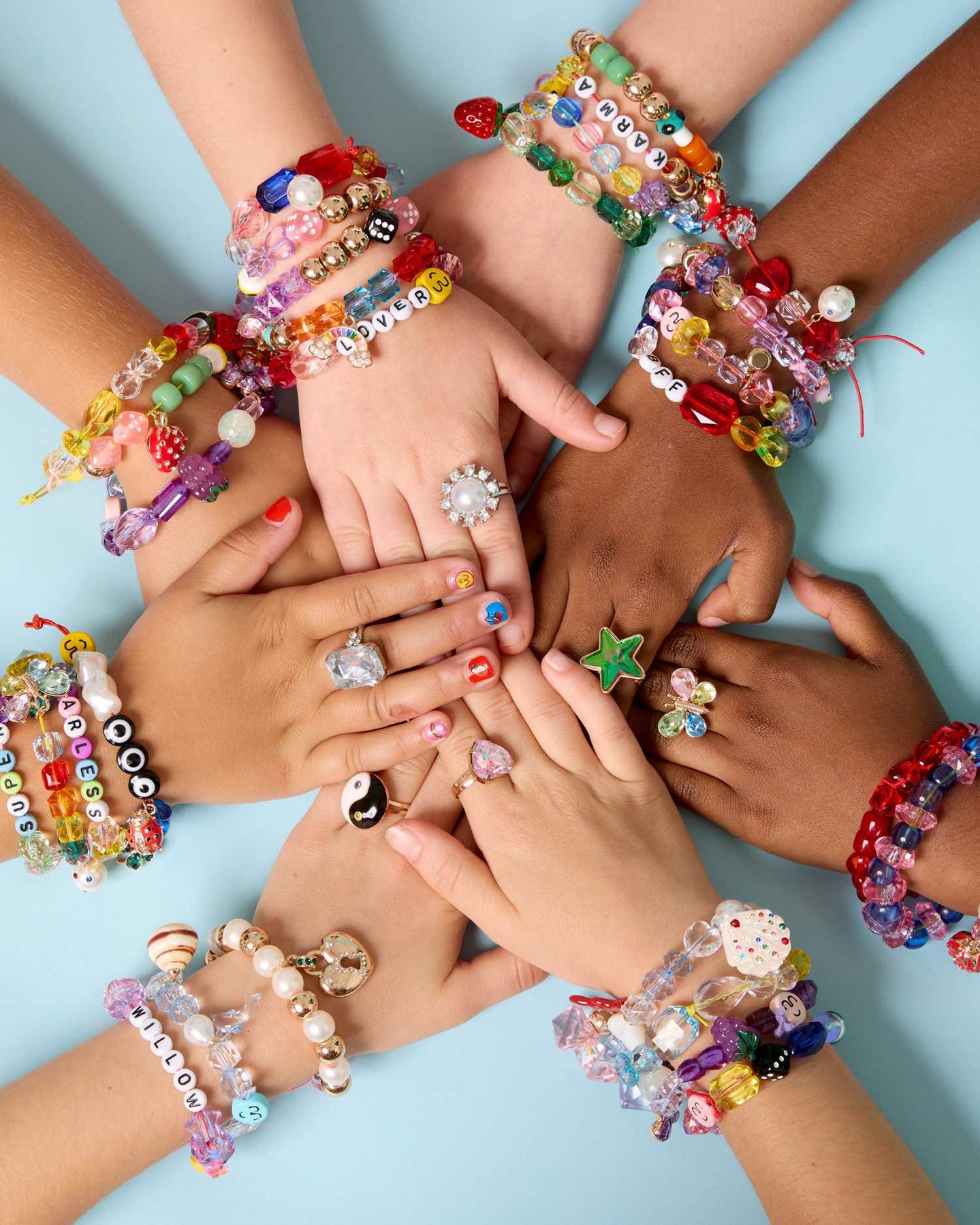 A child's hand with a  jewelry