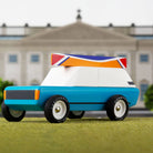 Model car with a colorful roof in front of a building