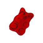 Red gummy bear-shaped object on a white background