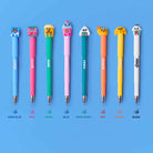 Set of colorful pens with cartoon characters on a blue background