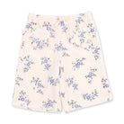 A pair of girls' shorts in a soft cream fleece fabric with a blue and green floral print, featuring an elastic waistband and drawstring.