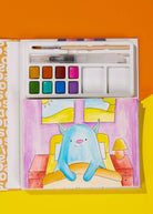 Artistic depiction of a blue creature in a room with watercolor paints and brushes.