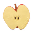 Toy apple with a face on a white background