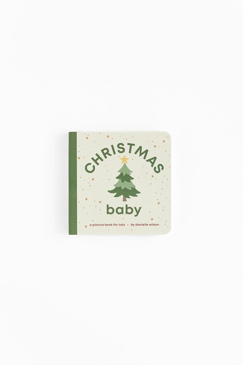 Book titled 'Christmas Baby' with a green tree illustration on a white background