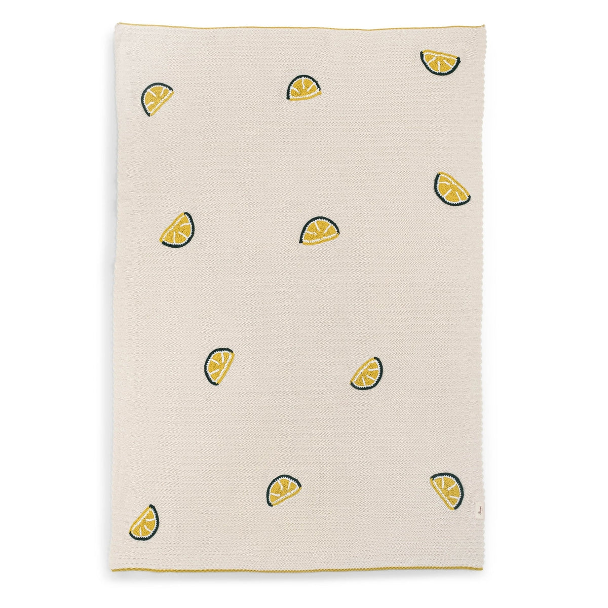 Beige towel with lemon slice pattern on a white background