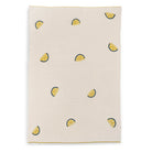 Beige towel with lemon slice pattern on a white background