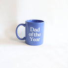 Blue mug with 'Dad of the Year' text on a white background