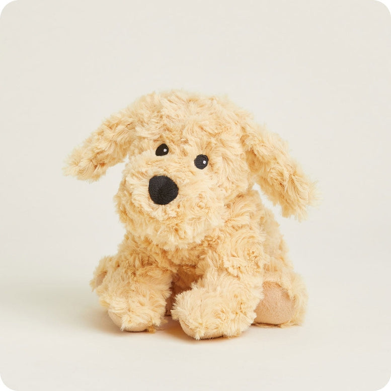 A soft cream-colored Golden Dog Junior plush toy by Warmies sitting upright against a neutral background.