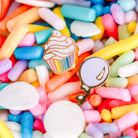 Colorful candy assortment with decorative pins on top