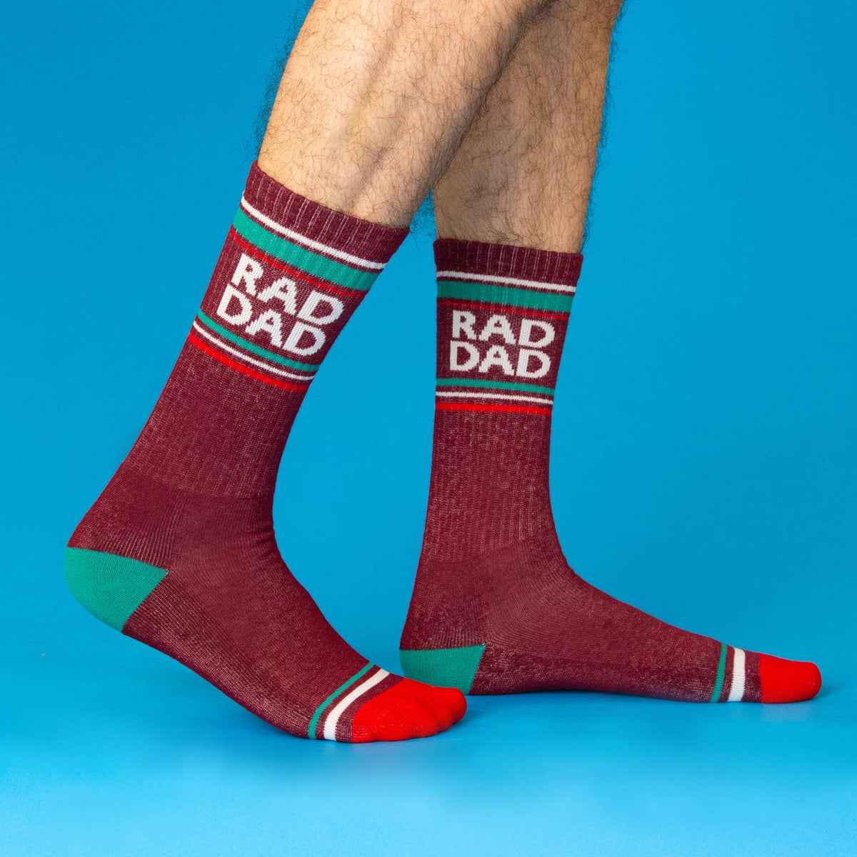 Maroon socks with 'RAD DAD' text on a blue background