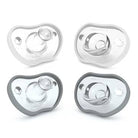 Four gray pacifiers on a white background