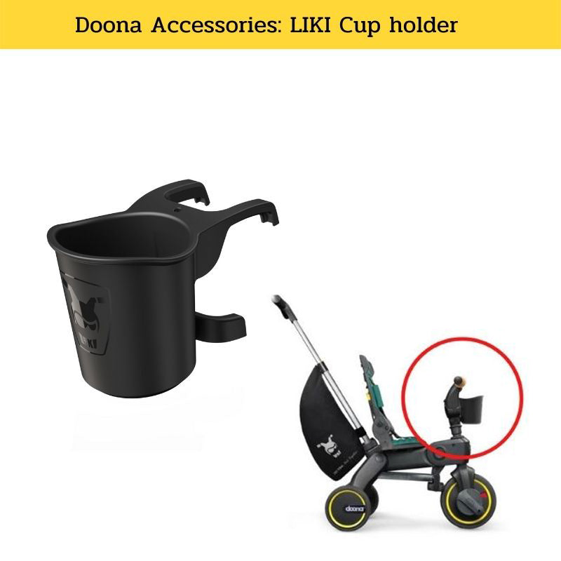 Black cup holder attached to a Doona tricycle on a white background