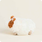 Plush toy resembling a dog with brown and white fur on a light background