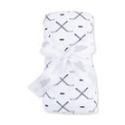 White swaddle blanket with hockey stick pattern on a white background