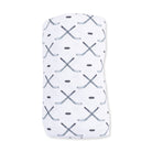 A white ribbed knit baby blanket featuring a repeating pattern of crossed hockey sticks and hockey pucks in dark gray, shown on a plain white background.