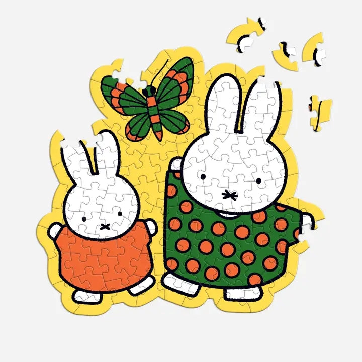 Children's puzzle with two cartoon bunnies and a butterfly on a white background