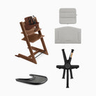 Collage of a wooden high chair with accessories on a white background