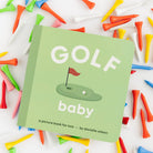 Children's book titled 'Golf Baby' surrounded by colorful golf tees on a white background