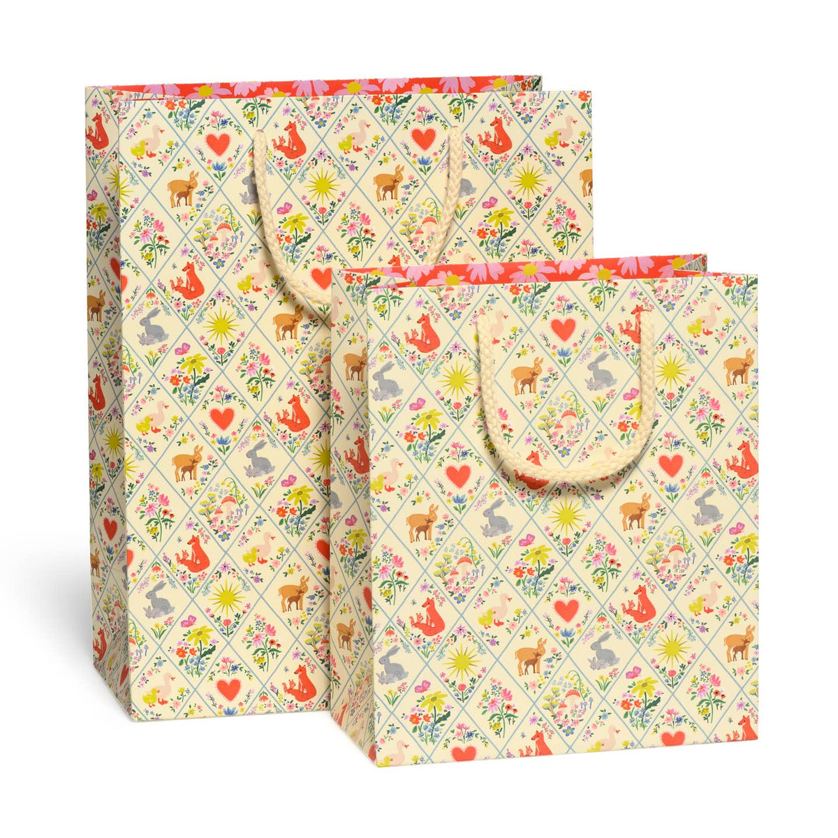 Two gift bags with a colorful animal pattern on a white background